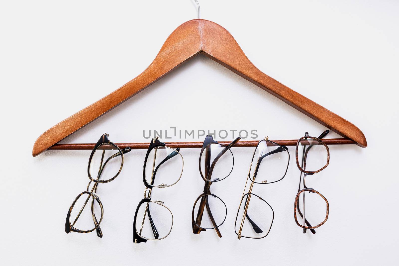 glasses weighing on a hanger on a white background by wip3out