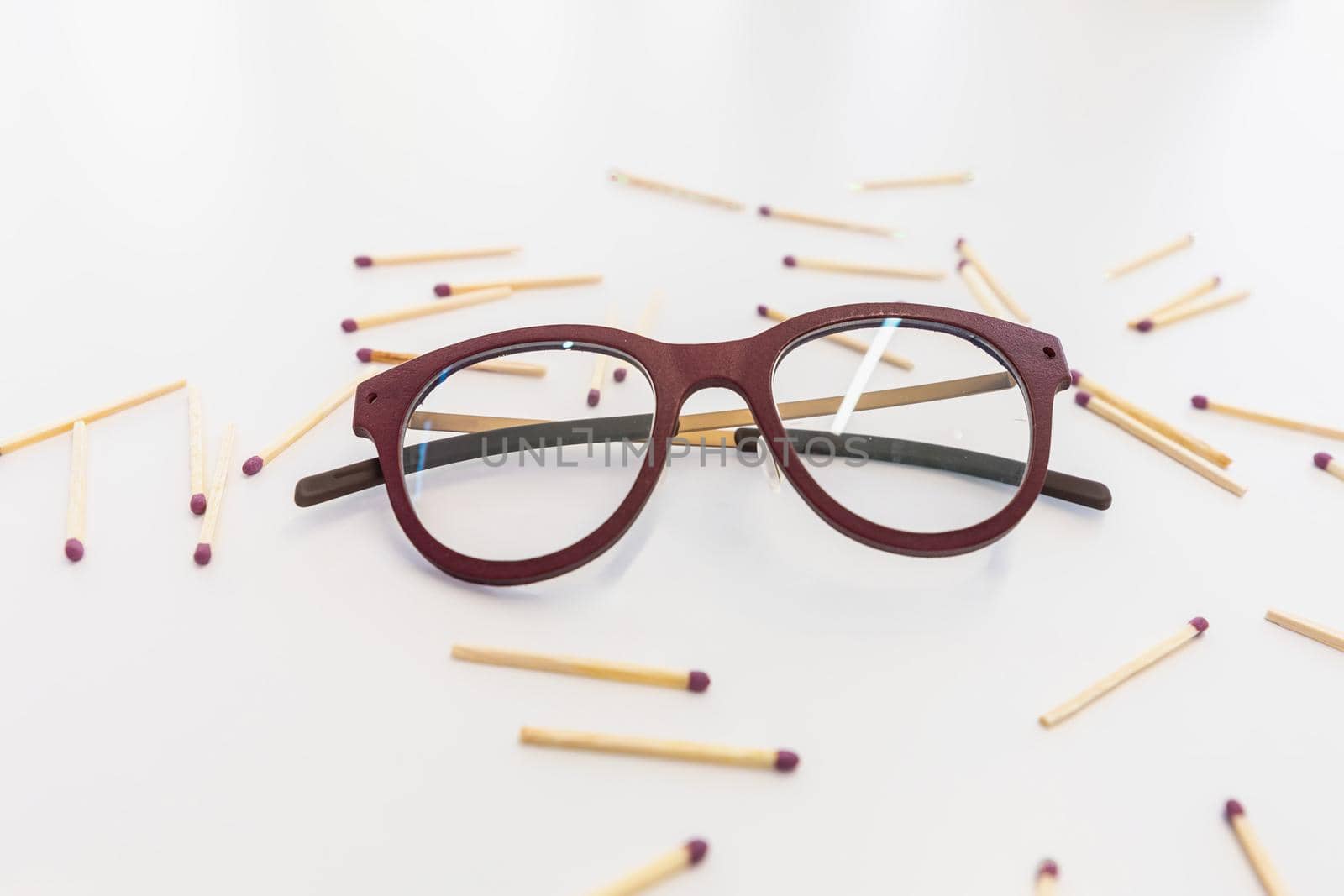 Glasses on a white table surrounded by matches by wip3out