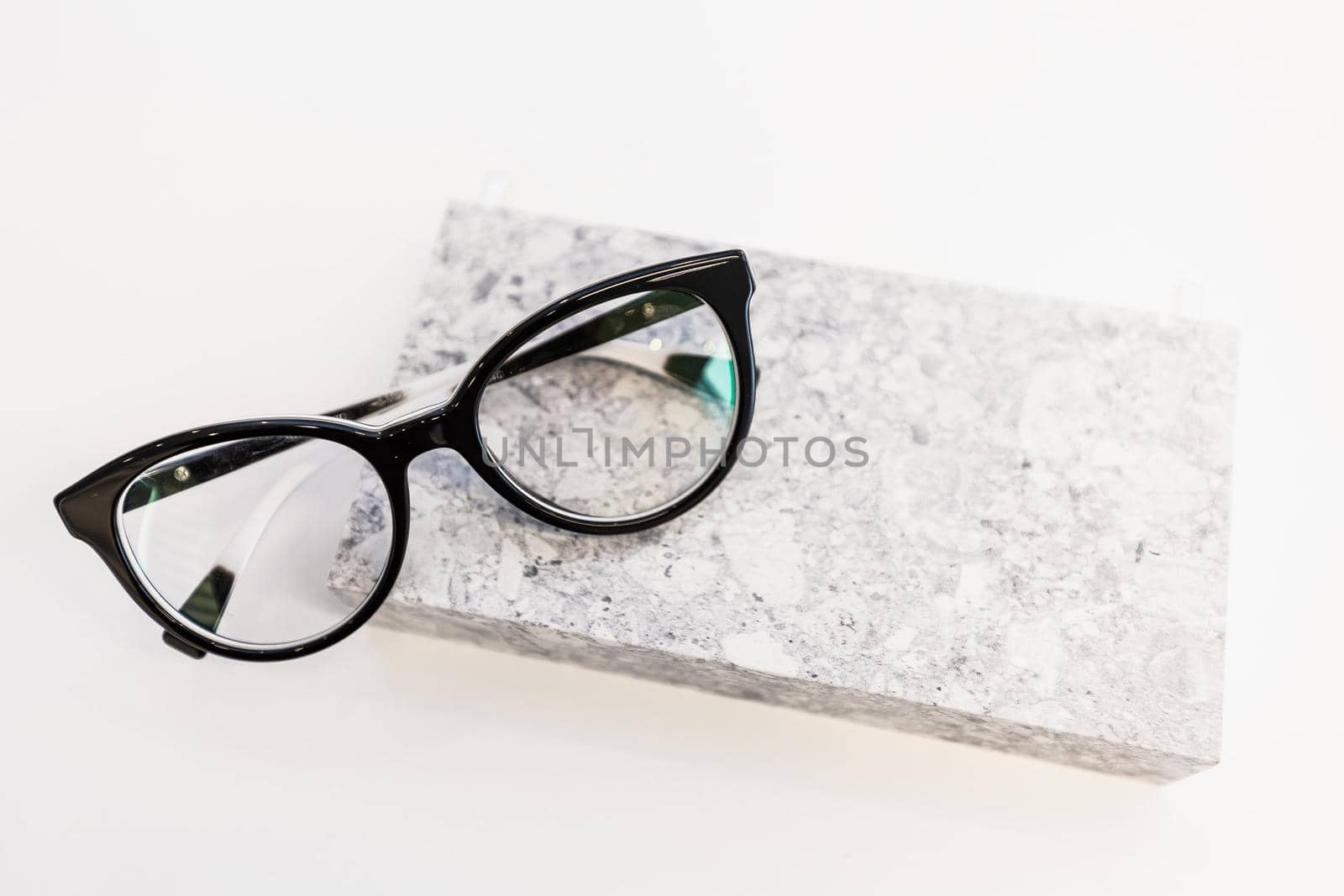 Workspace with glasses and a wallet on a background