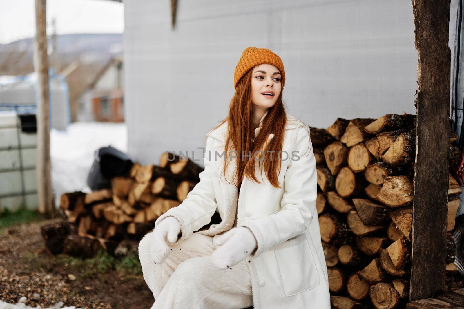 cheerful woman firewood for the stove price nature rest winter holidays by SHOTPRIME