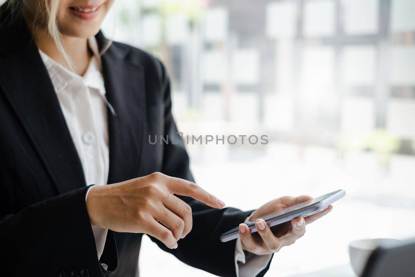 A businesswoman completes KYC using an online banking program in order to open a digital savings account. The definition of cyber security