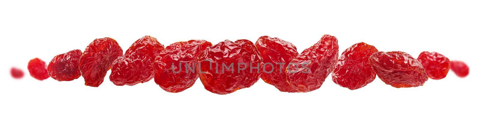 Dried dogwood berries levitate on a white background.