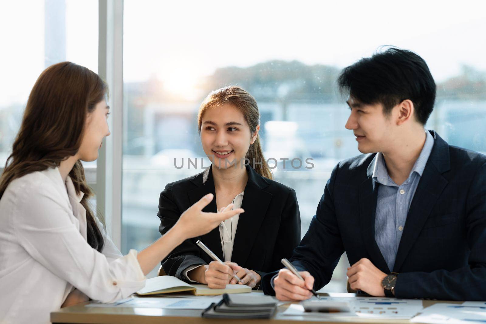 Business team discuss at meeting room. Financial accountant , consultation, planner , meeting , introduction concept. by itchaznong