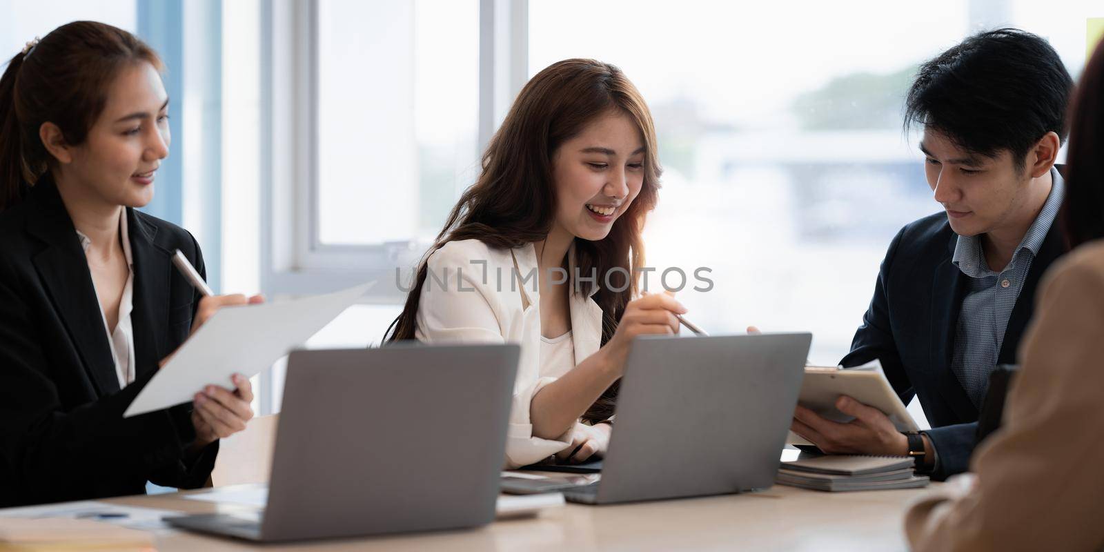 Group of Business people and Accountant checking data document on digital tablet for investigation of corruption account. Anti Bribery concept. by itchaznong