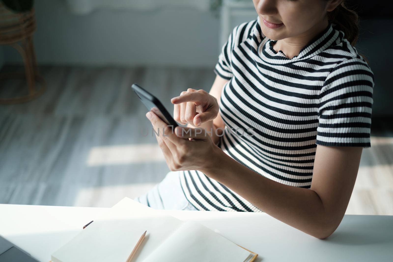 A businesswoman completes KYC using an online banking program in order to open a digital savings account. The definition of cyber security