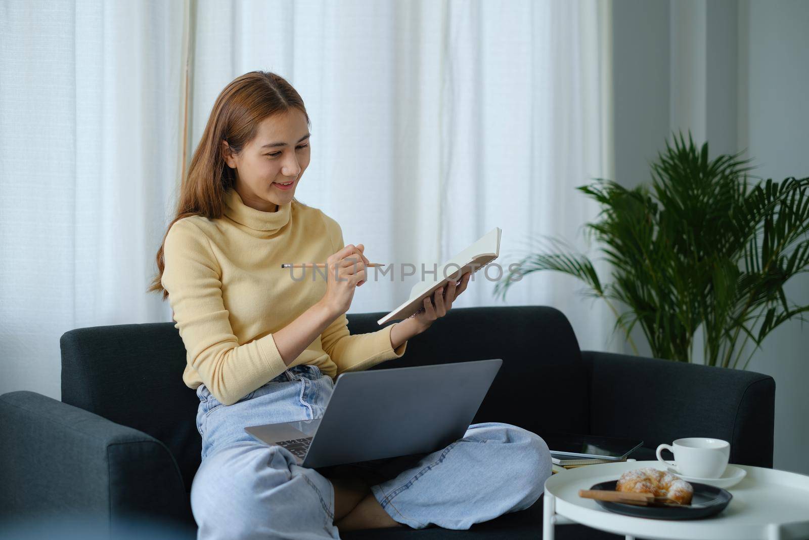 E-learning ,online ,education and internet social distancing protect from COVID-19 viruses concept. Asian woman student video conference e-learning with teacher on laptop at home