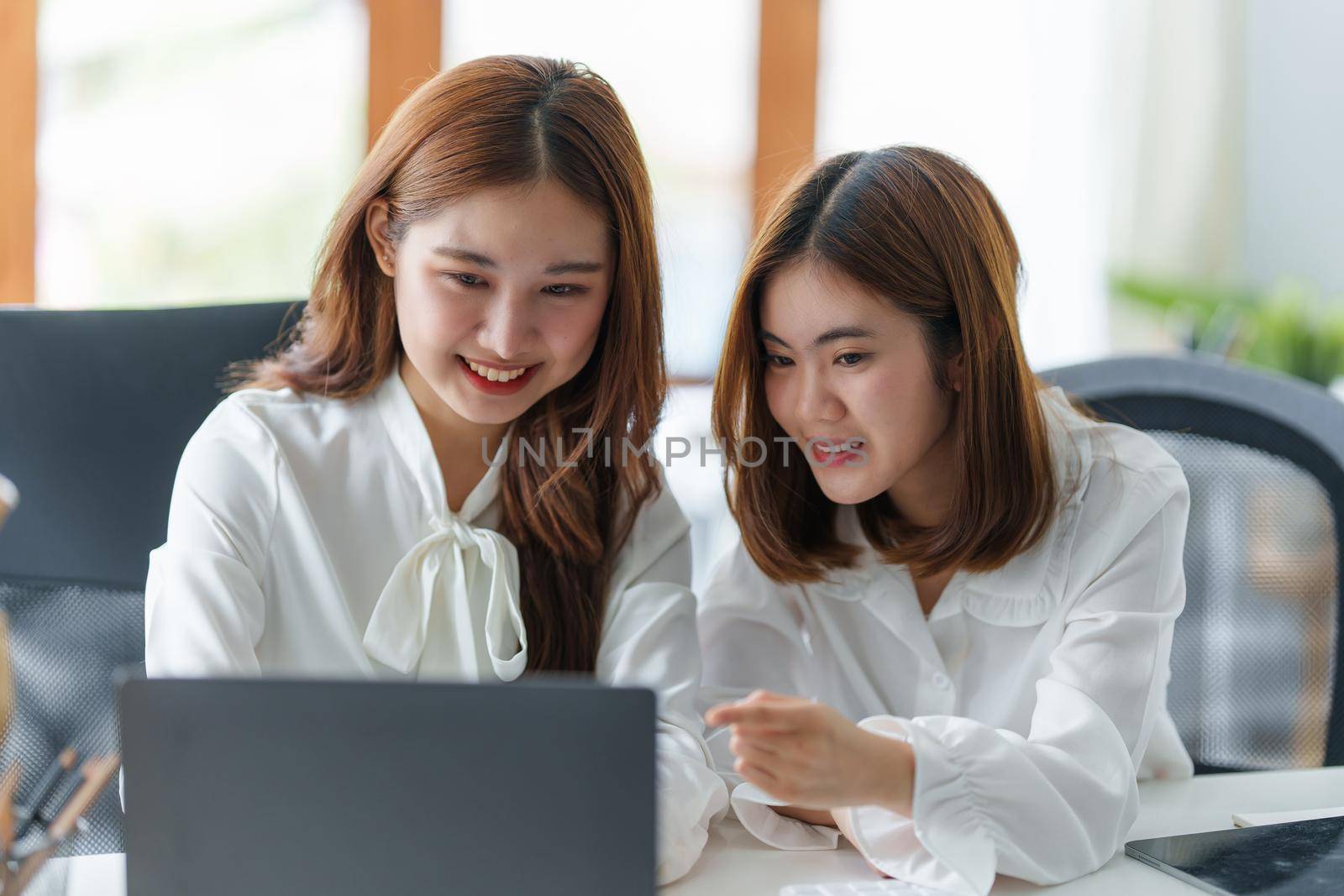 Two girl watching content on laptop computer. Youth, lifestyle, communication concept