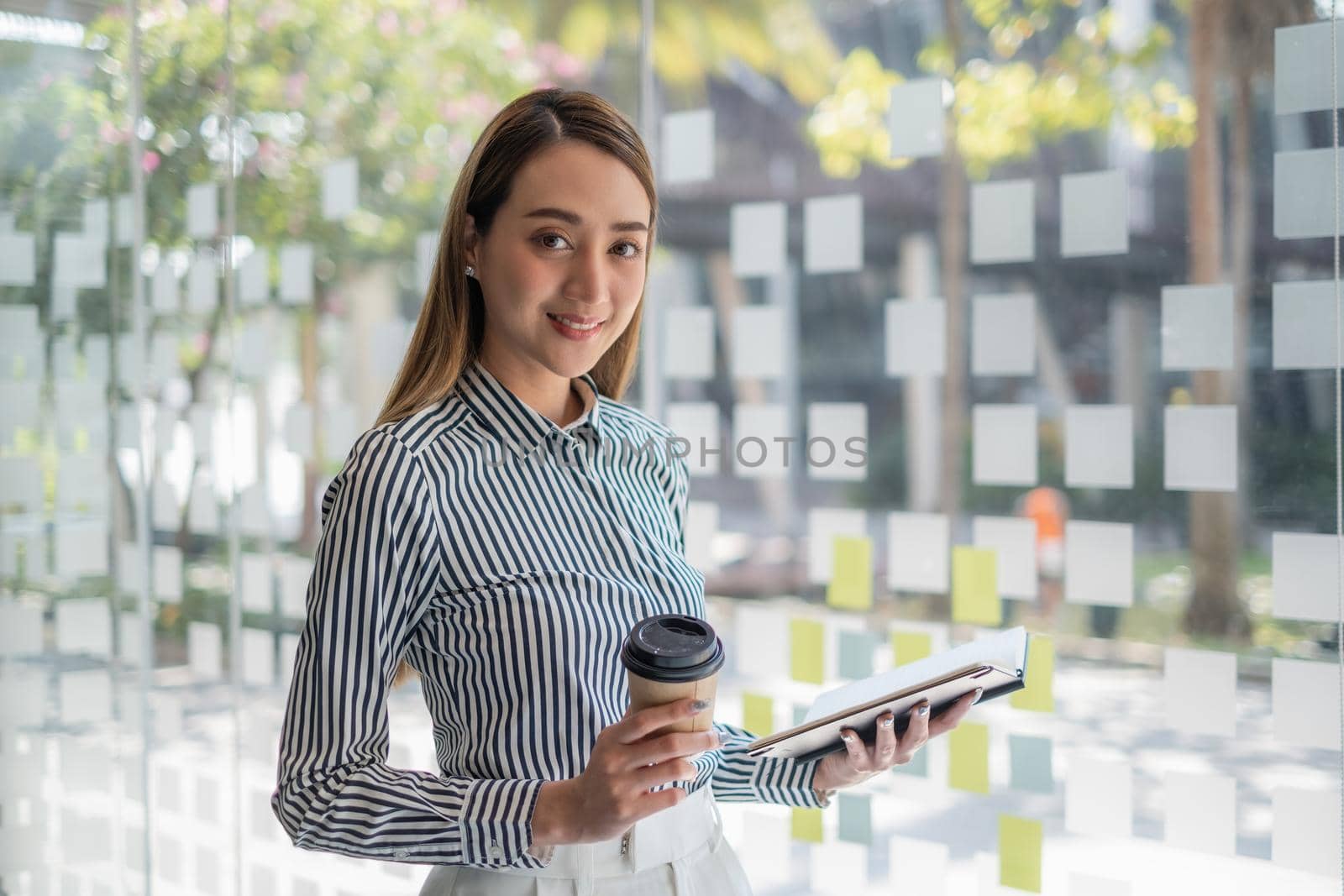 Asian Business woman working to analyze technical price graph and indicator. Account or saving money or insurance concept