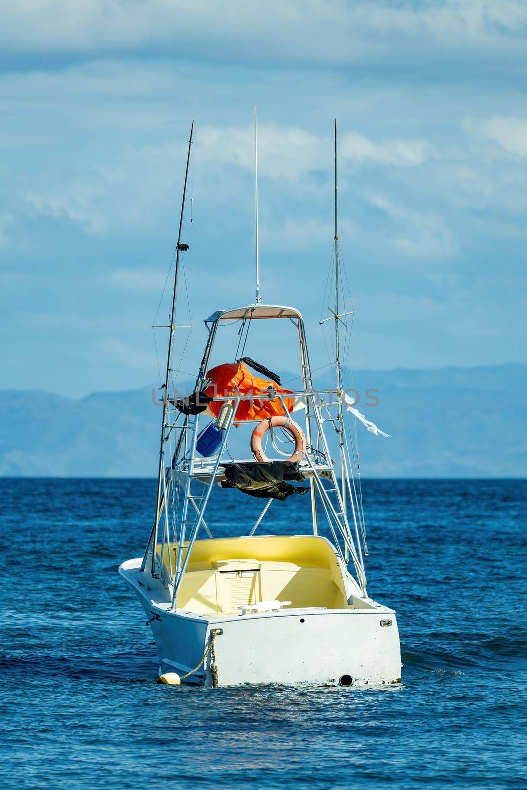 Motor boat anchored on Ocotal beach, Pacific ocean, El Coco Costa Rica by artush