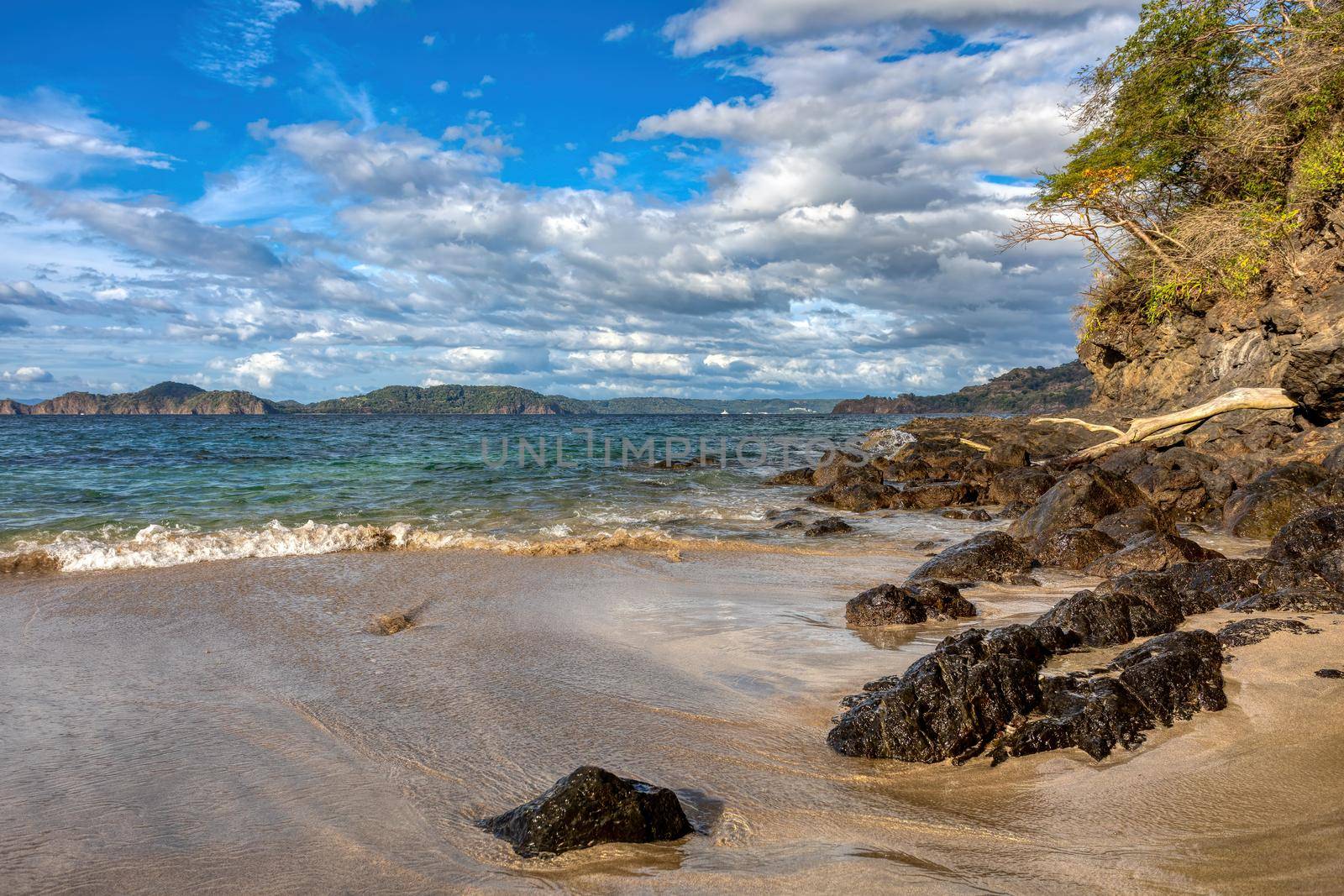 pacific ocean waves on rock in Playa Todo Aventura, El Coco Costa Rica by artush