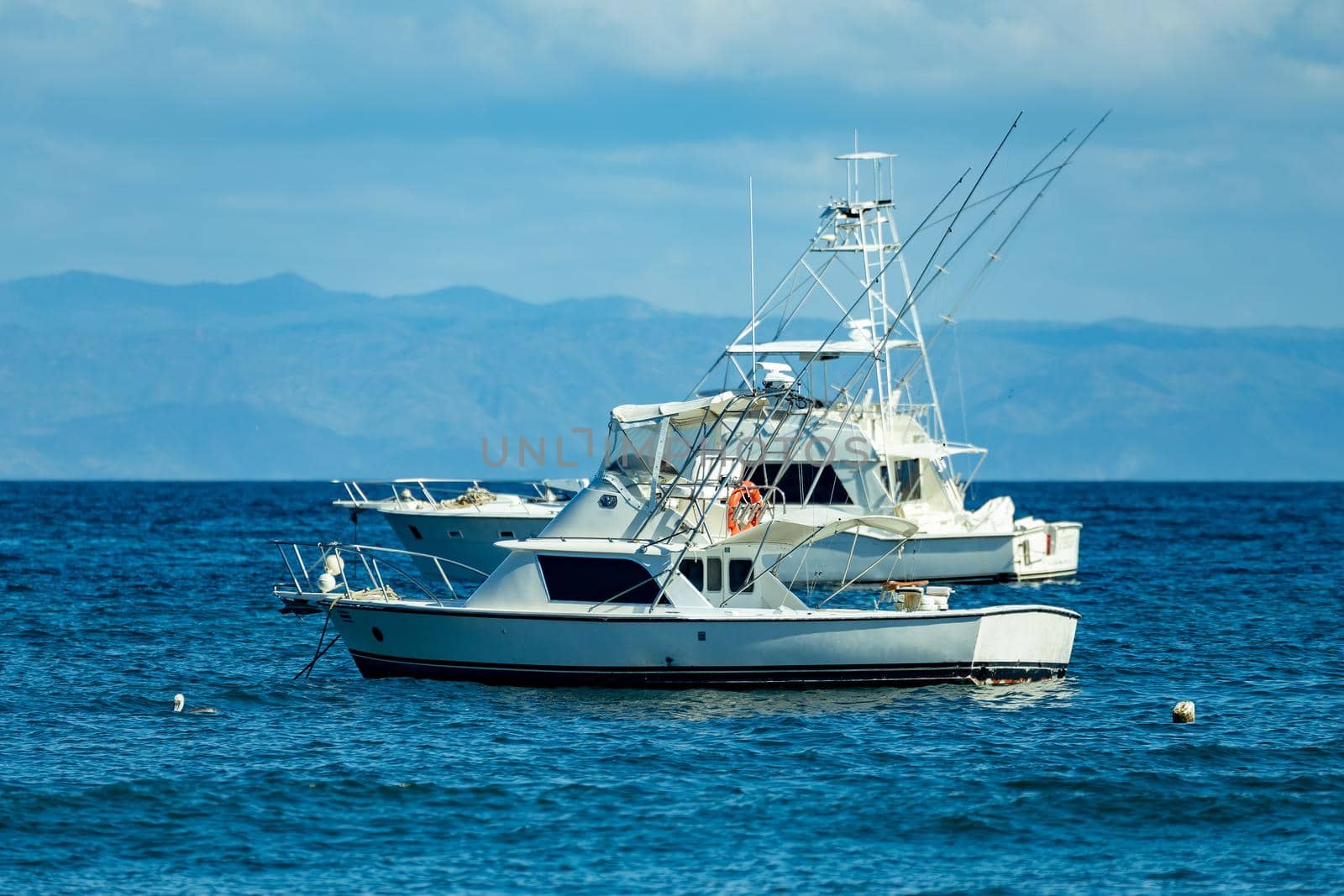 Motor boat anchored on Ocotal beach, Pacific ocean, El Coco Costa Rica by artush