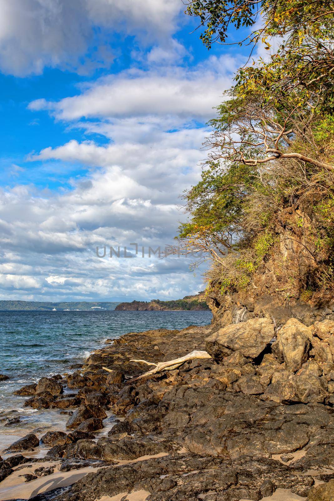 pacific ocean on Playa Todo Aventura, El Coco Costa Rica. Famous snorkel beach. Picturesque paradise tropical landscape of Costa Rica beach. Pura Vida concept, travel to exotic tropical country.