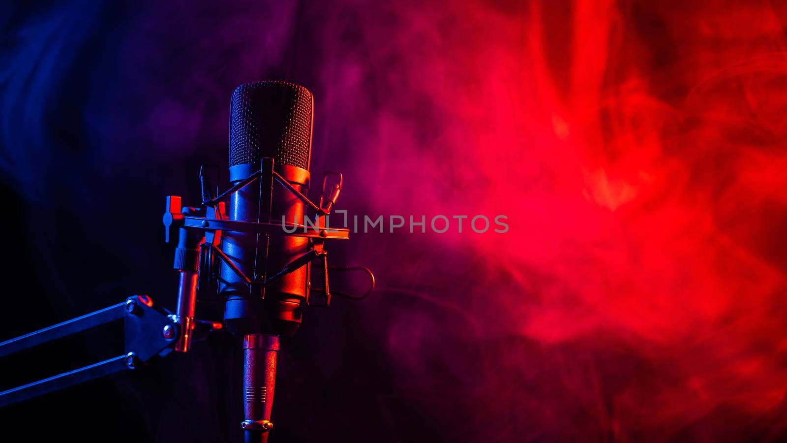 Professional microphone in pink smoke on a black background. by mrwed54