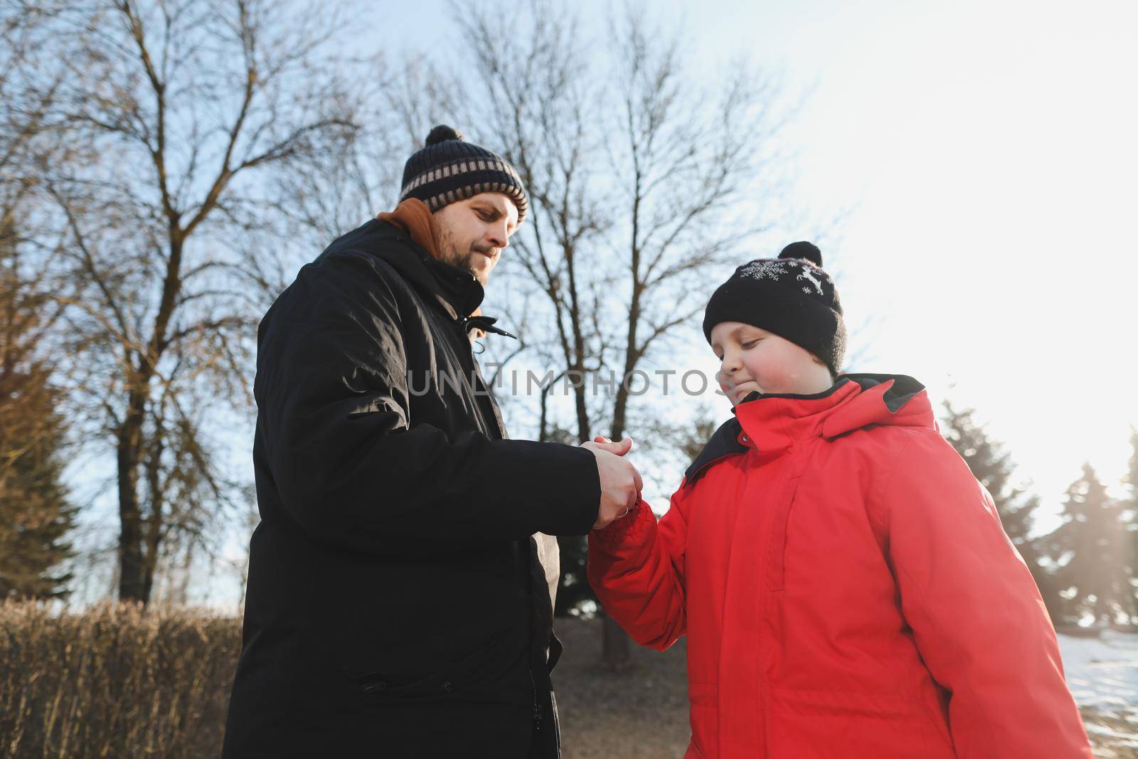 happy father and son having fun outdoors in spring. 