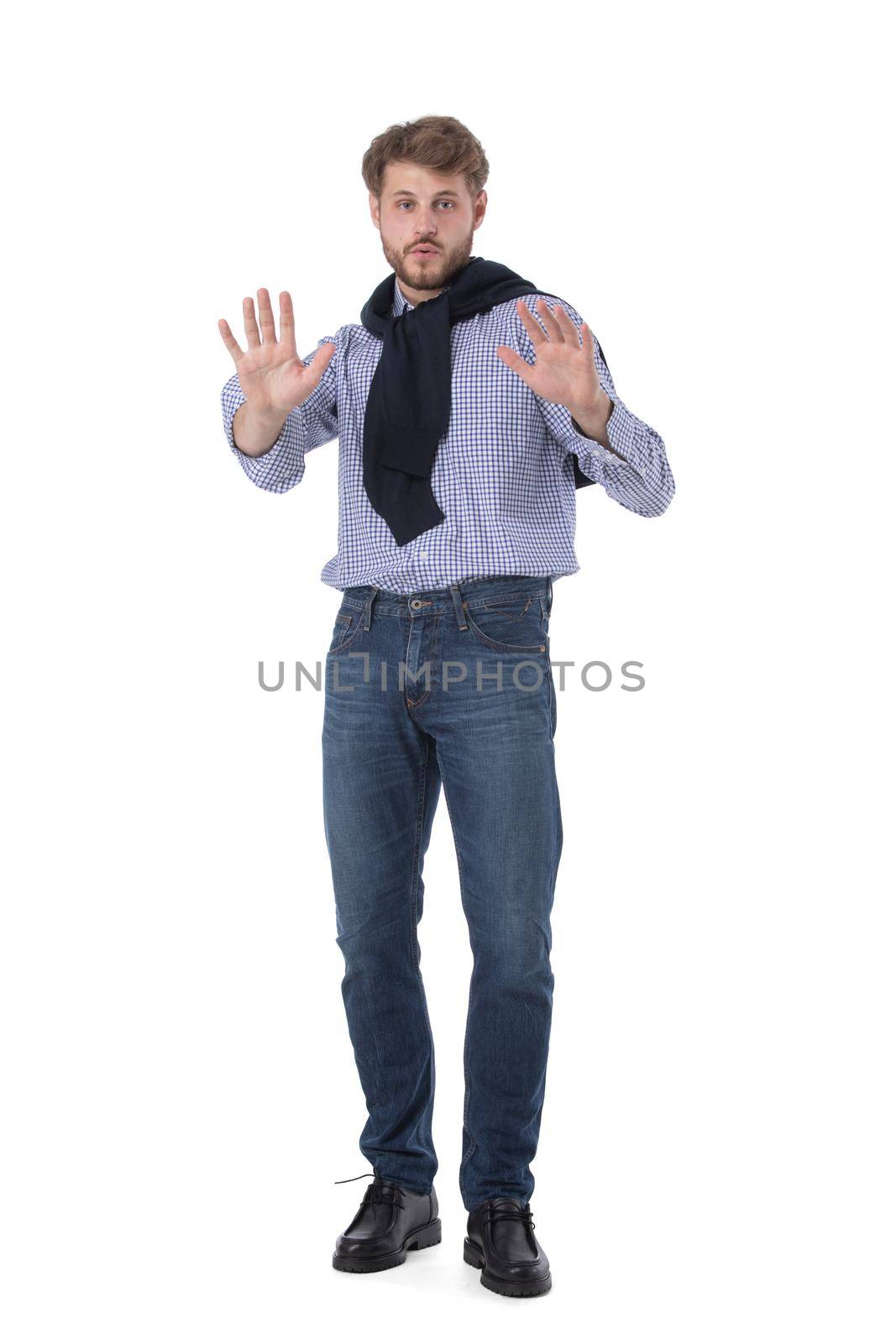Full length portrait of handsome young business man in casual wear making stop gesture isolated on white background, casual people