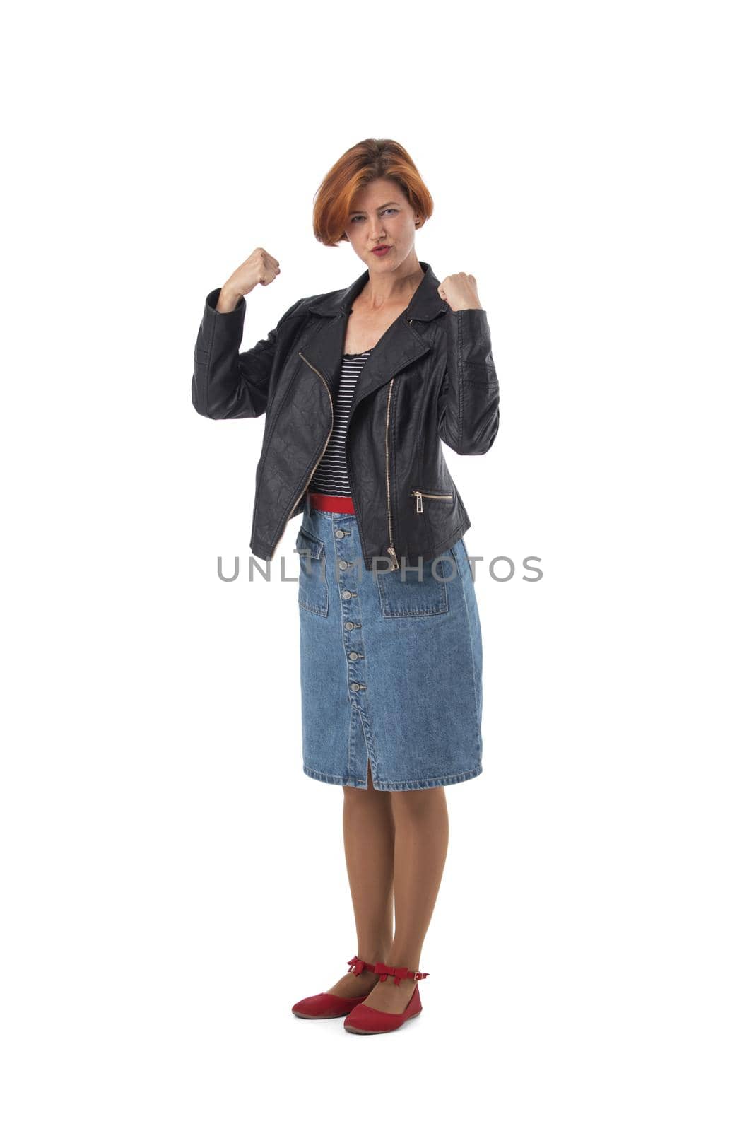 Full body shoot of happy redhead woman holding fists, isolated on white background