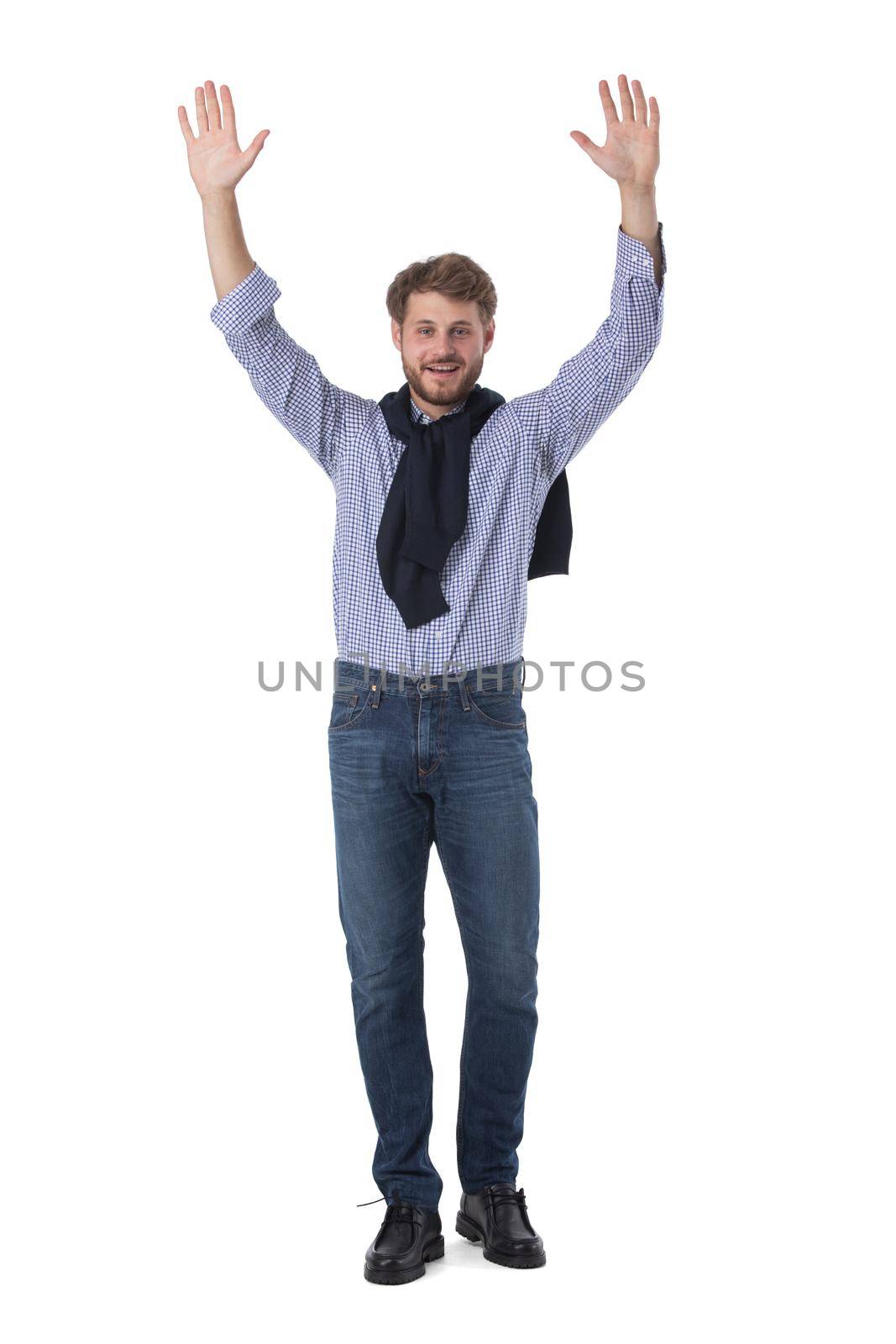 Full length portrait of handsome young business man in casual wear with raised hands isolated on white background, casual people