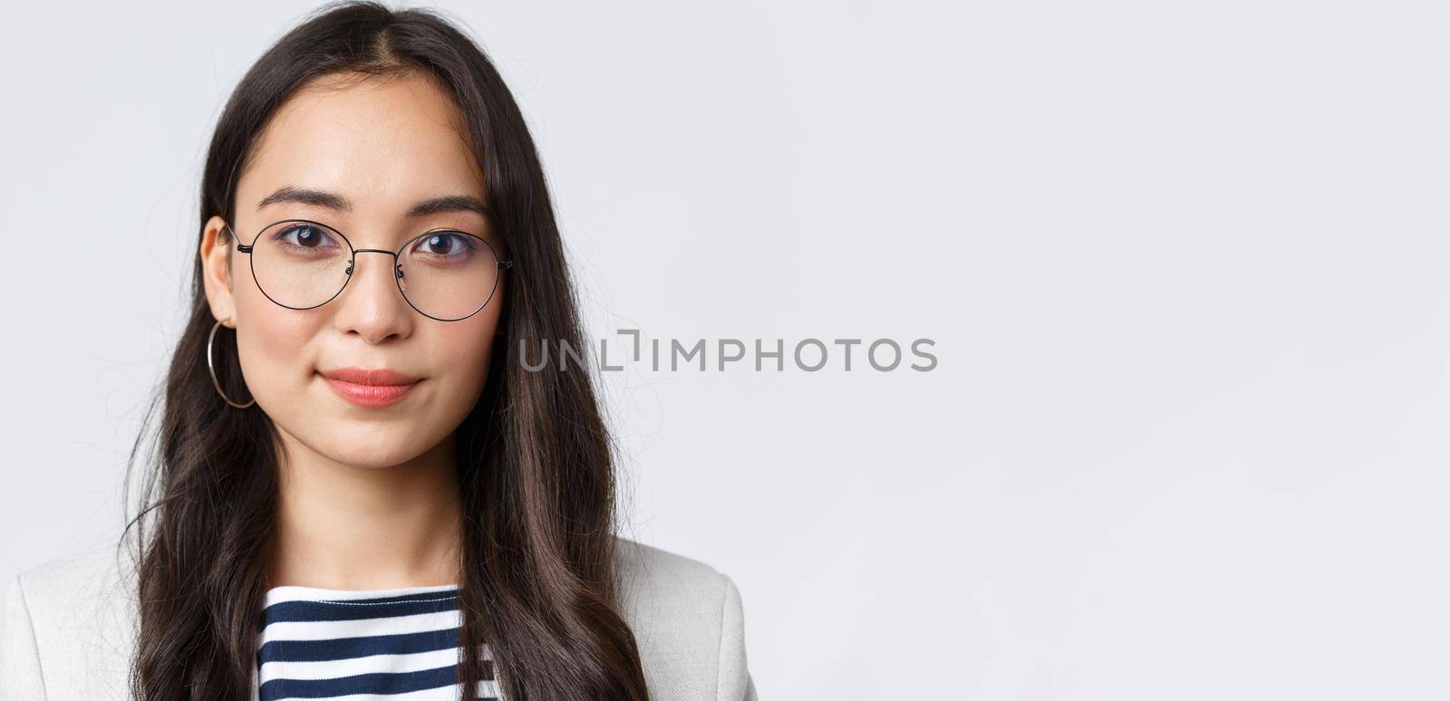 Business, finance and employment, female successful entrepreneurs concept. Close-up of modern stylish asian businesswoman in glasses looking confident and determined at camera by Benzoix