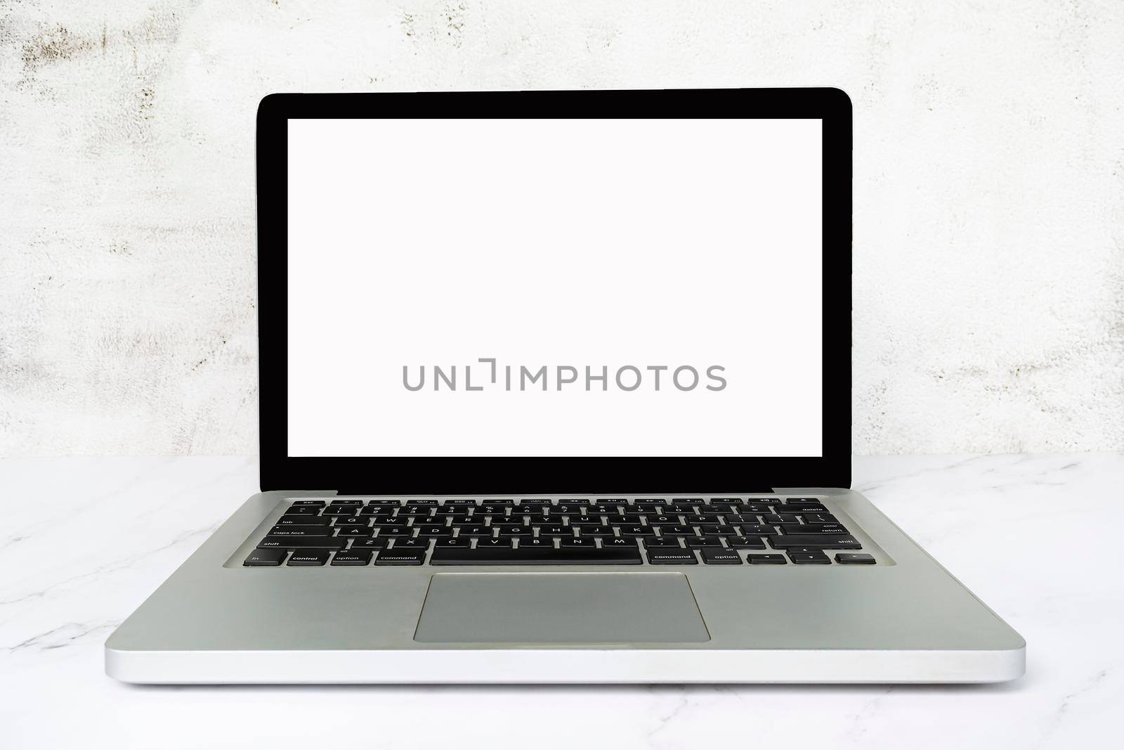 Laptop or notebook with blank screen on white table. Business concept. Copy space.