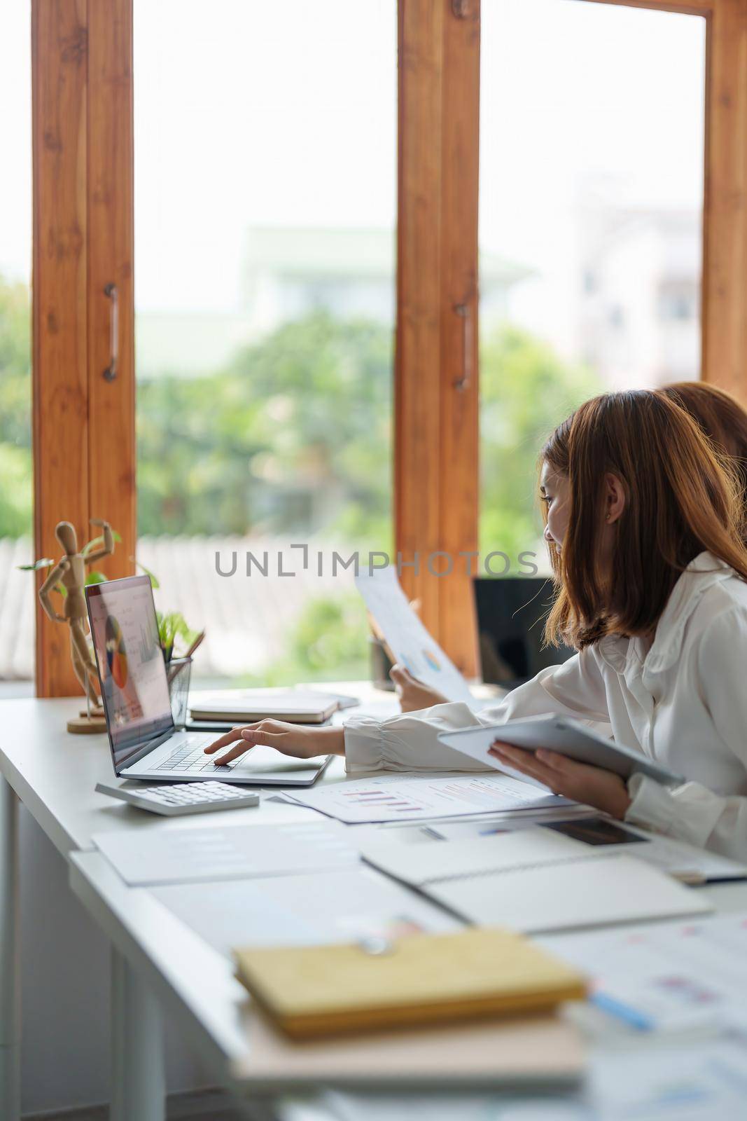 Business People Talking Discussing with coworker planning analyzing financial document data charts and graphs in Meeting and successful teamwork Concept.