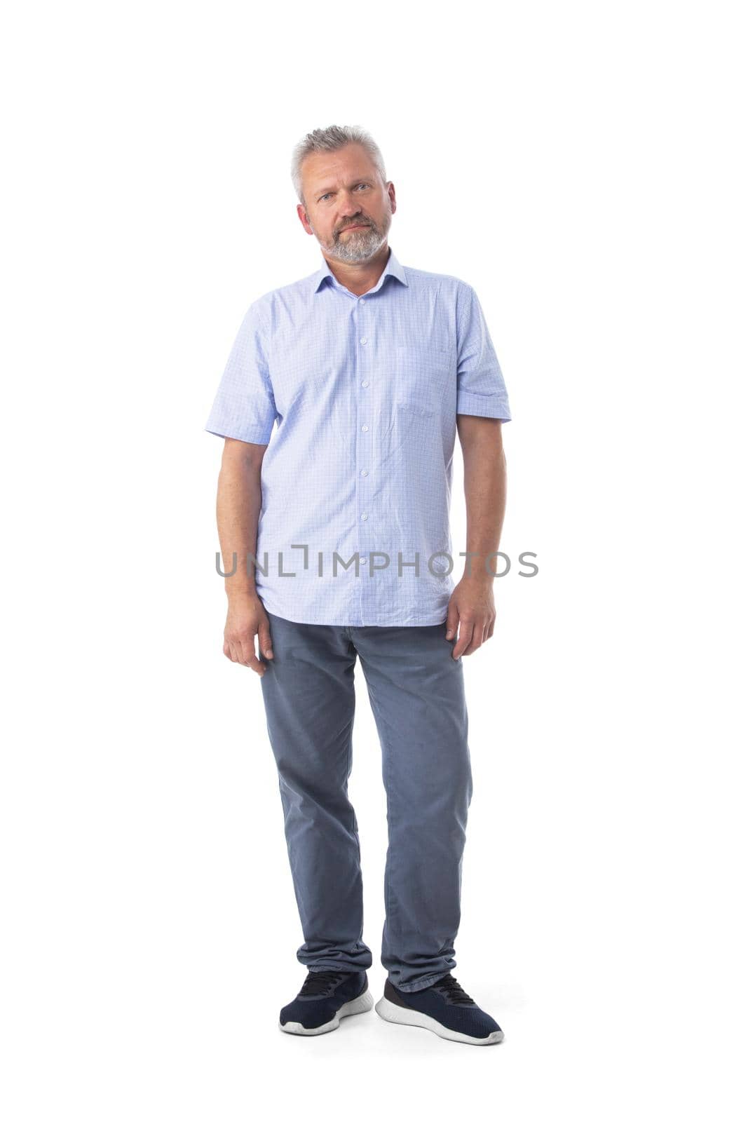 Full length portrait of mature man in casual clothes isolated on white background