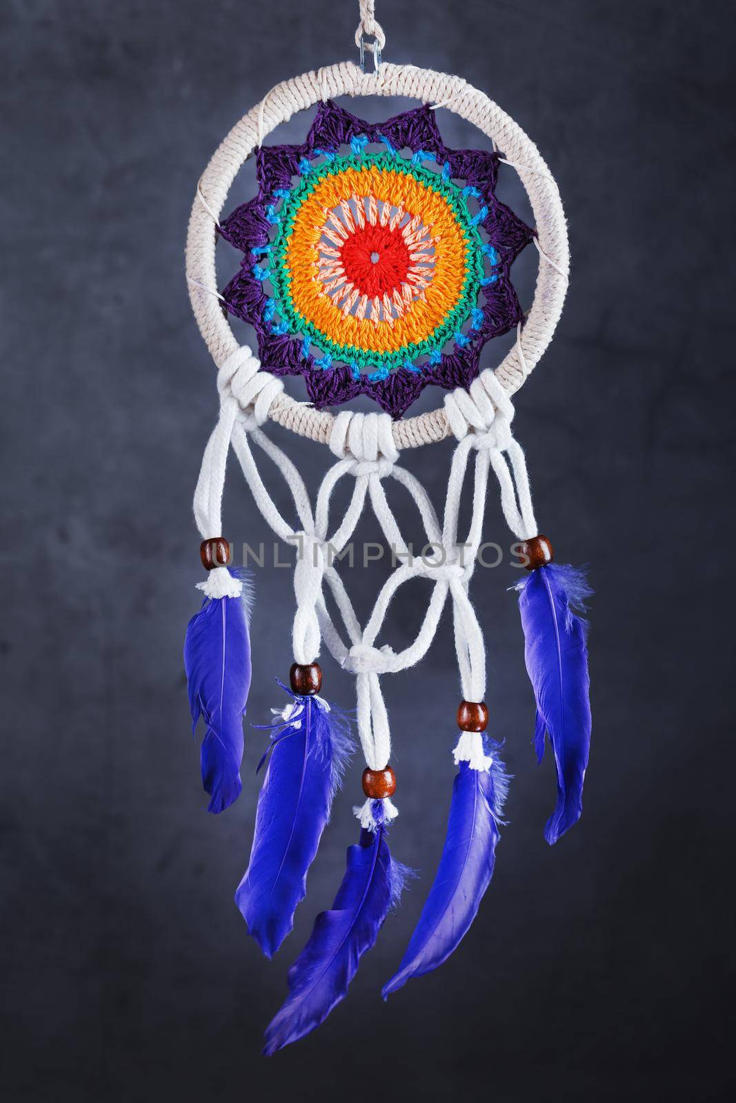 Amulet Dreamcatcher on a black background close-up protecting the sleeper from evil spirits and diseases
