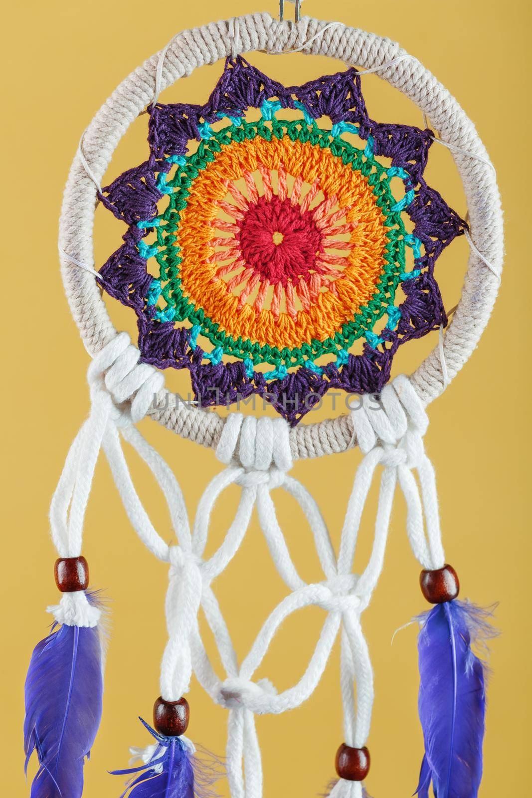 Amulet Dreamcatcher on a yellow background close-up protecting the sleeper by AlexGrec