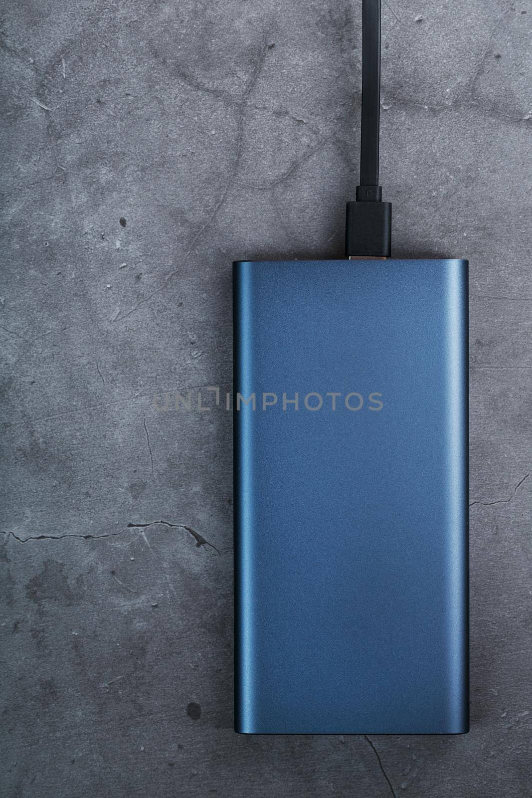 Battery Power supply for recharging gadgets and electronic devices on a dark background