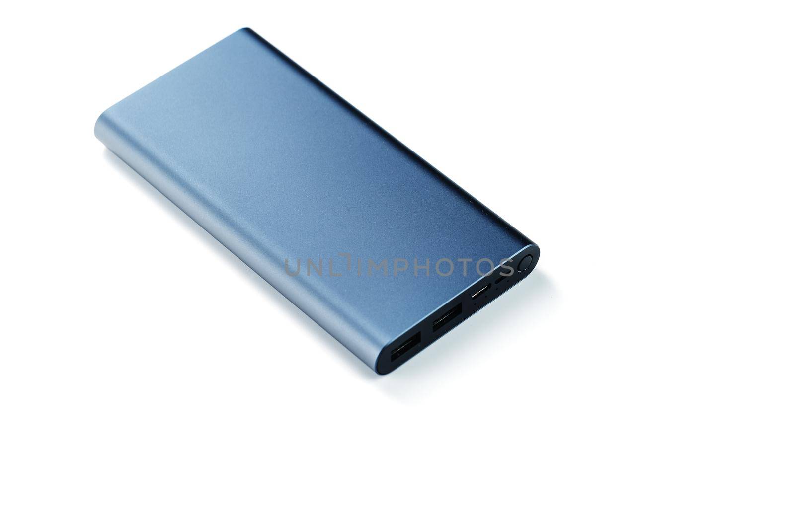 Blue Power Bank for charging mobile devices isolated on white background with copy space.
