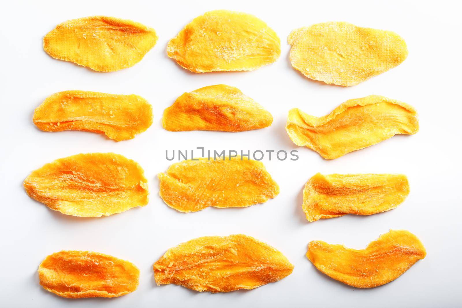 Orange Slices of Dried Sugar Mango Isolated on White Background