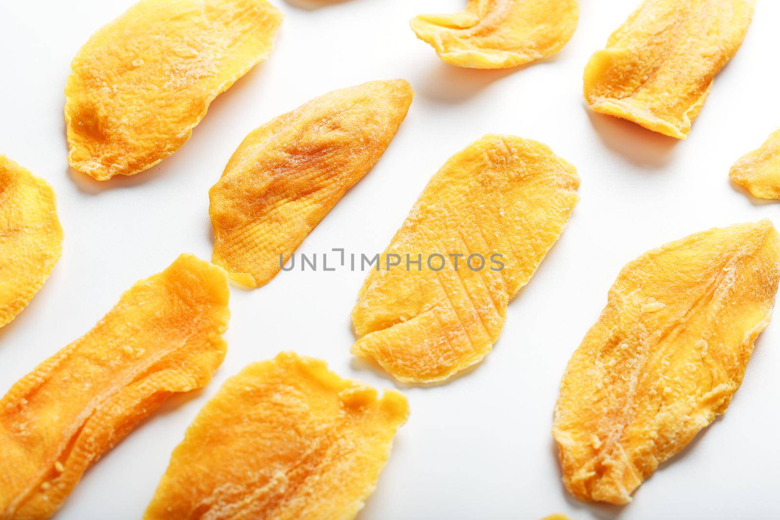 Orange Slices of Dried Sugar Mango Isolated on White Background