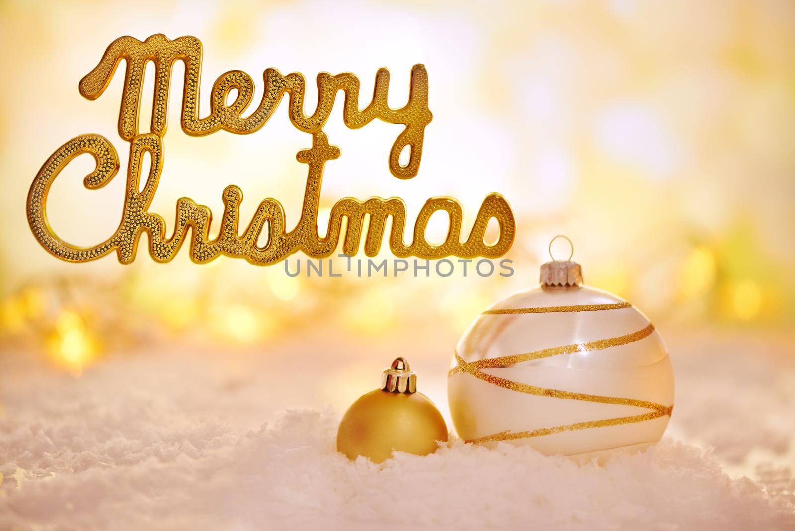Shot of golden Christmas decorations with a merry christmas message.