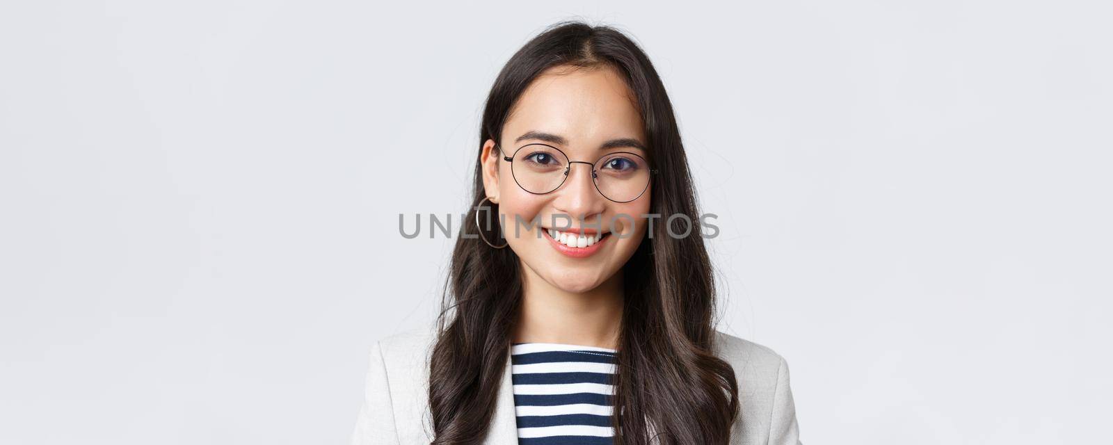 Business, finance and employment, female successful entrepreneurs concept. Close-up of smiling asian beautiful businesswoman wearing glasses and suit, looking confident and happy by Benzoix