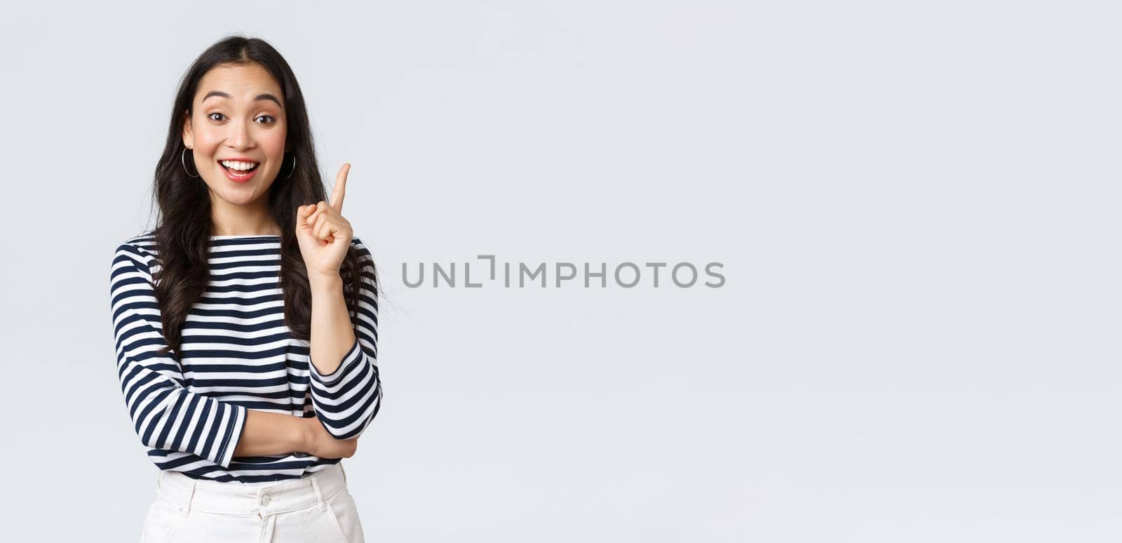 Lifestyle, people emotions and casual concept. Excited smart and creative asian female coworker have suggestion, add idea, raising index finger to say thought or plan, standing white background by Benzoix
