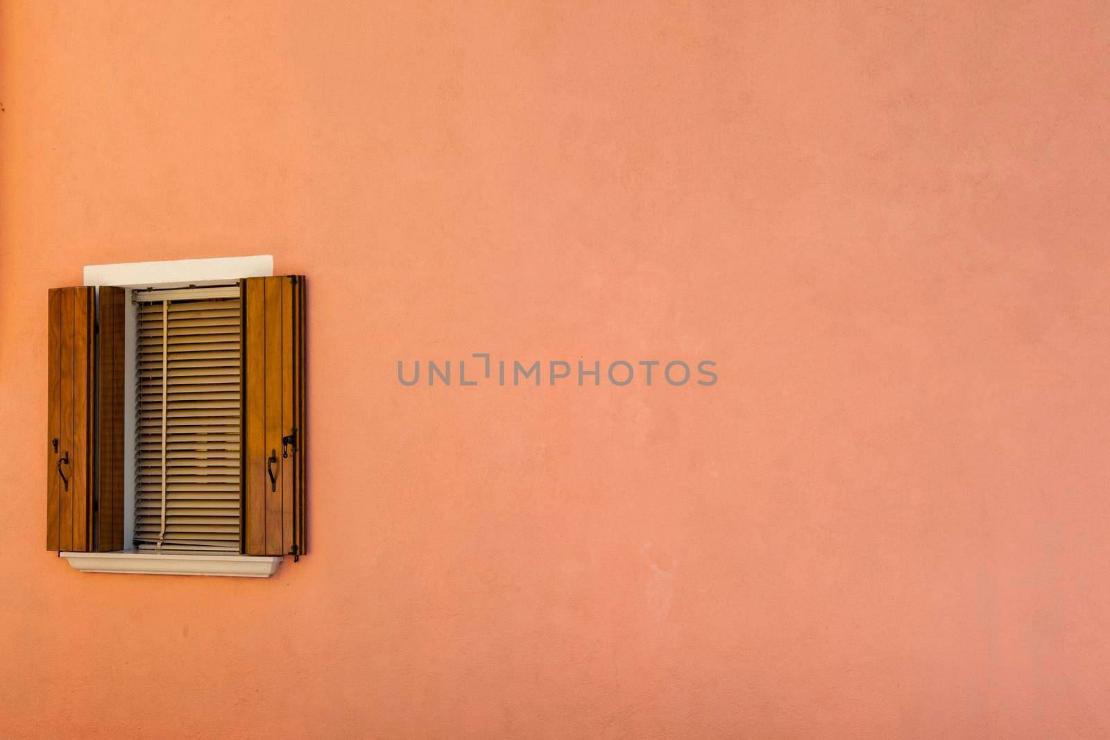 A window of one of the characteristic colored houses of Burano (Venice)