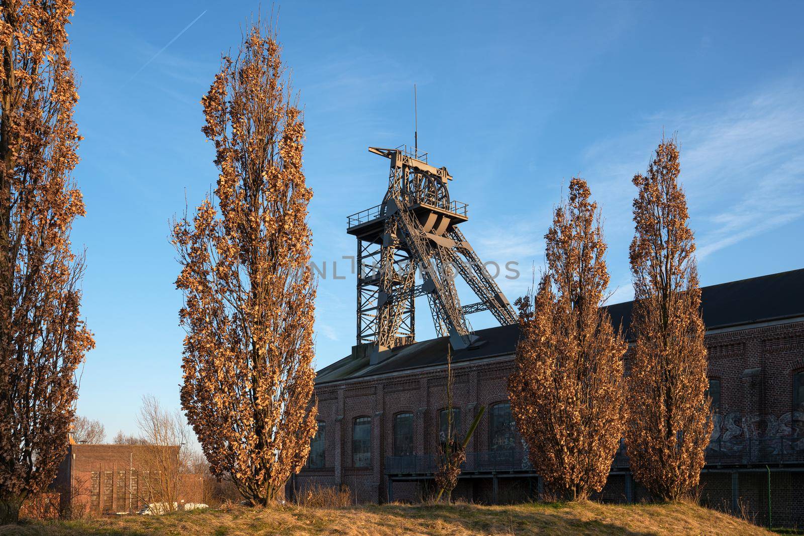 Headframe of old cold mine against sky, industrial heritage of Ruhr Metropolis, Dortmund, Germany
