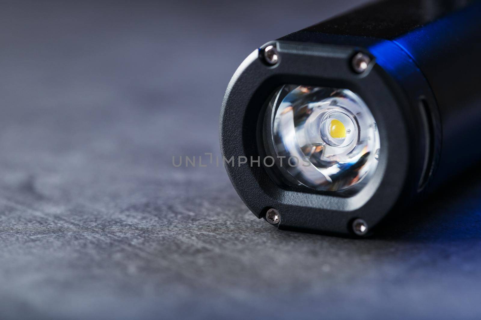 Led black lantern close-up on gray textured background, free space