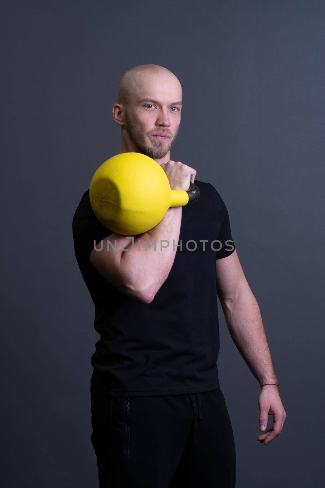 Guy with a yellow kettlebell gym anonymous workout man, for motivation effort in strong for floor weightlifting, asian fitness. Guy down endurance, building hiit
