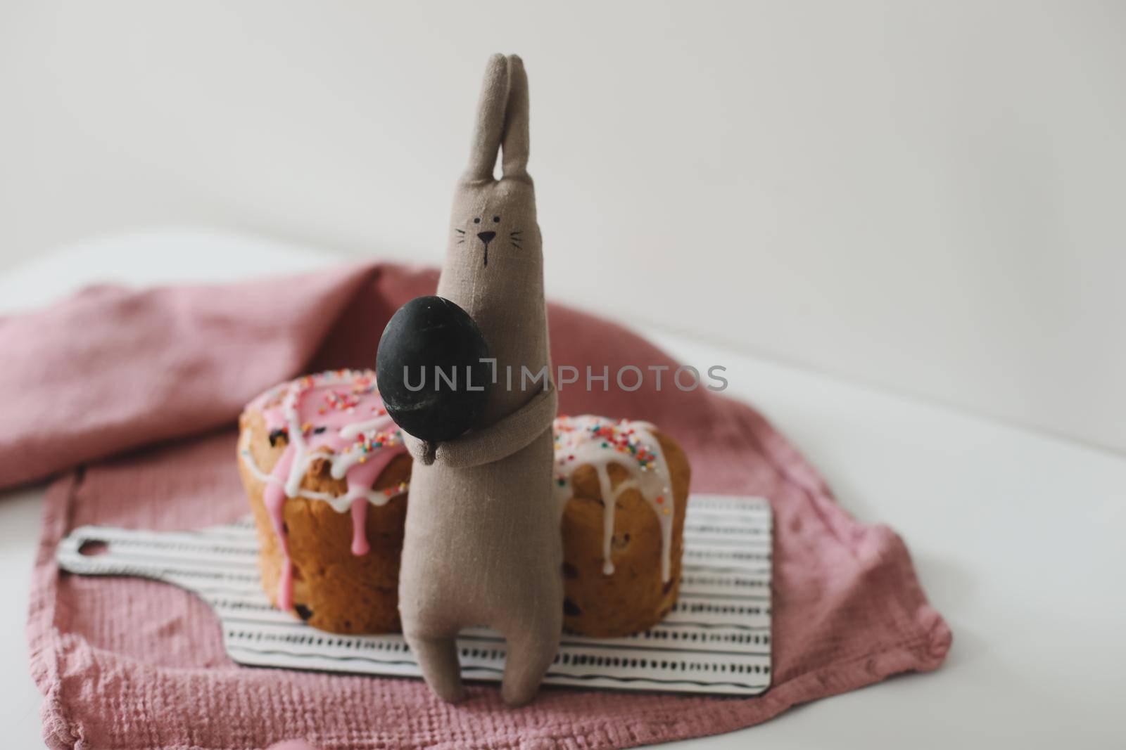 Easter cake, colorful eggs and rabbit toy. Happy Easter holiday concept. festive spring season.