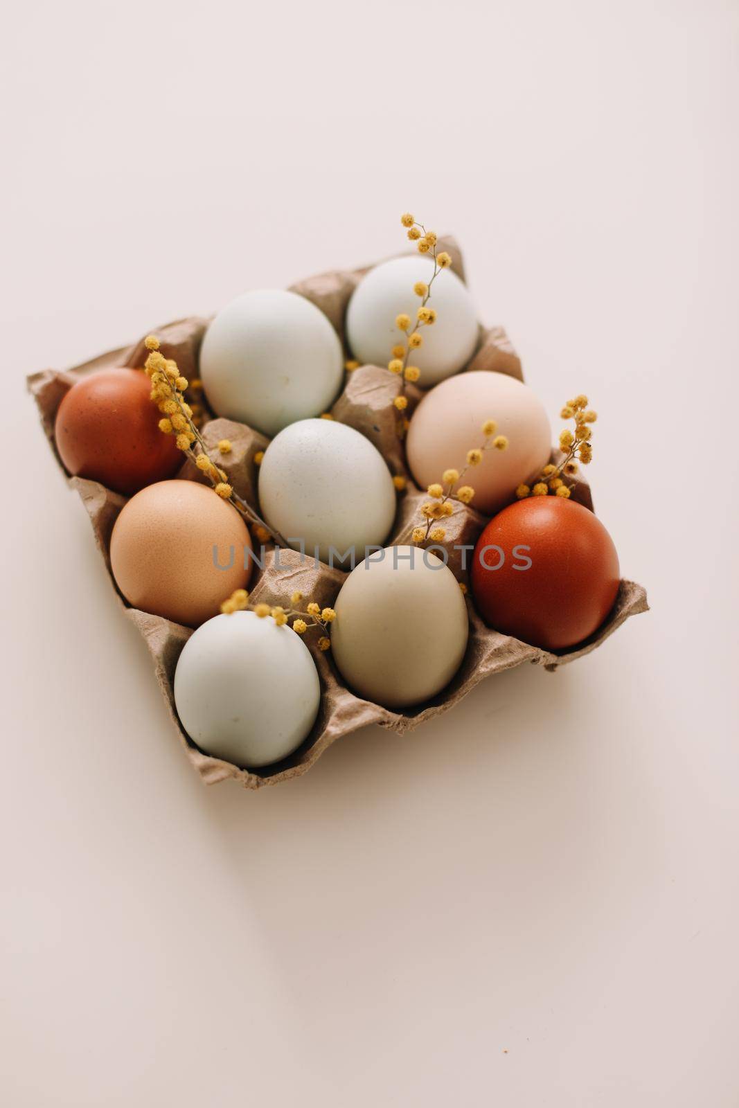Chicken eggs of natural shades and colors on a white background. Healthy organic food, natural farmer's products concept. Happy Easter background. Selective focus. 