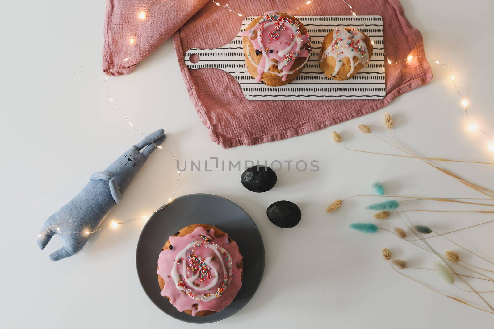 Easter cake, colorful eggs and rabbit toy. Happy Easter holiday concept. festive spring season.