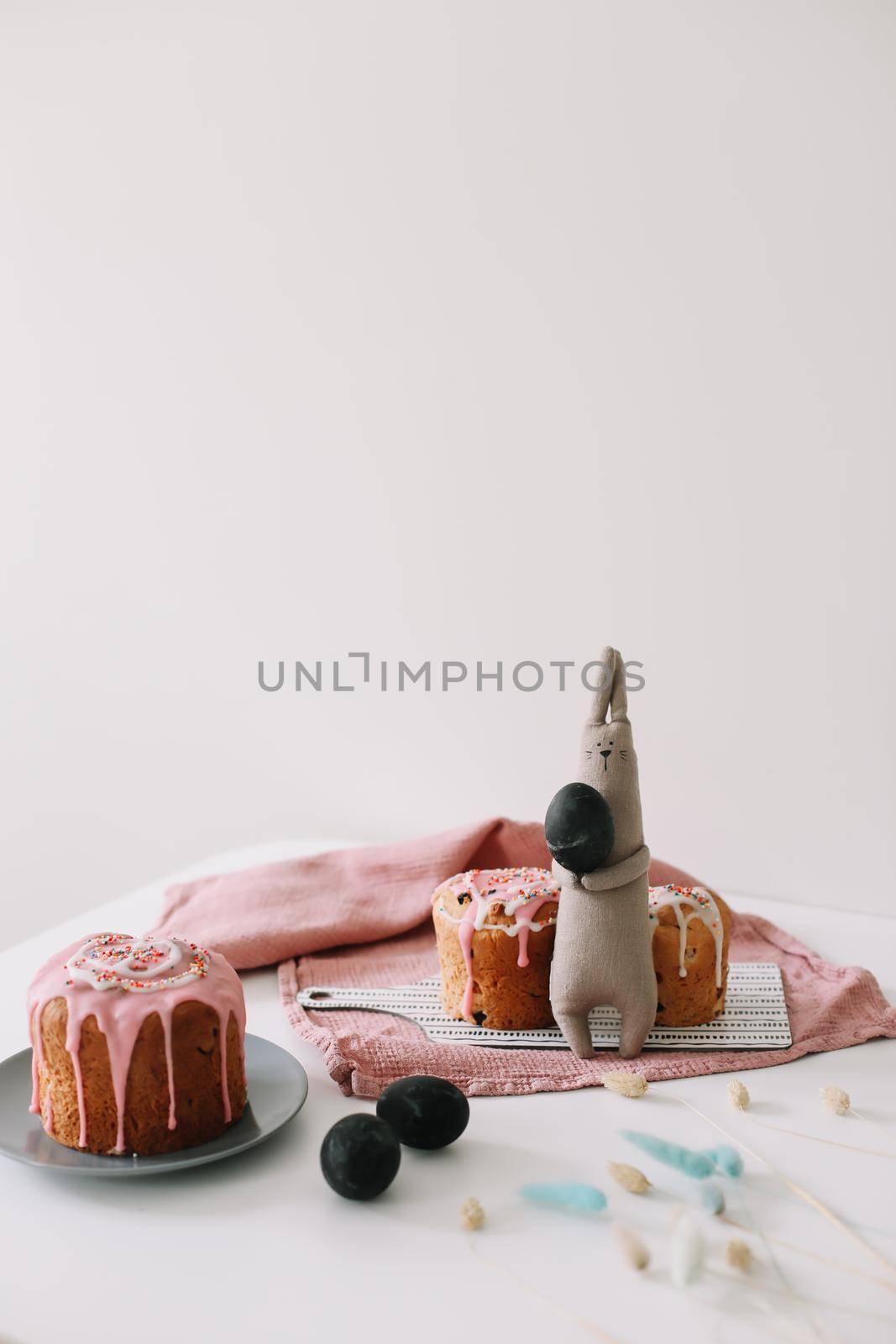 Easter cake, colorful eggs and rabbit toy. Happy Easter holiday concept. festive spring season.