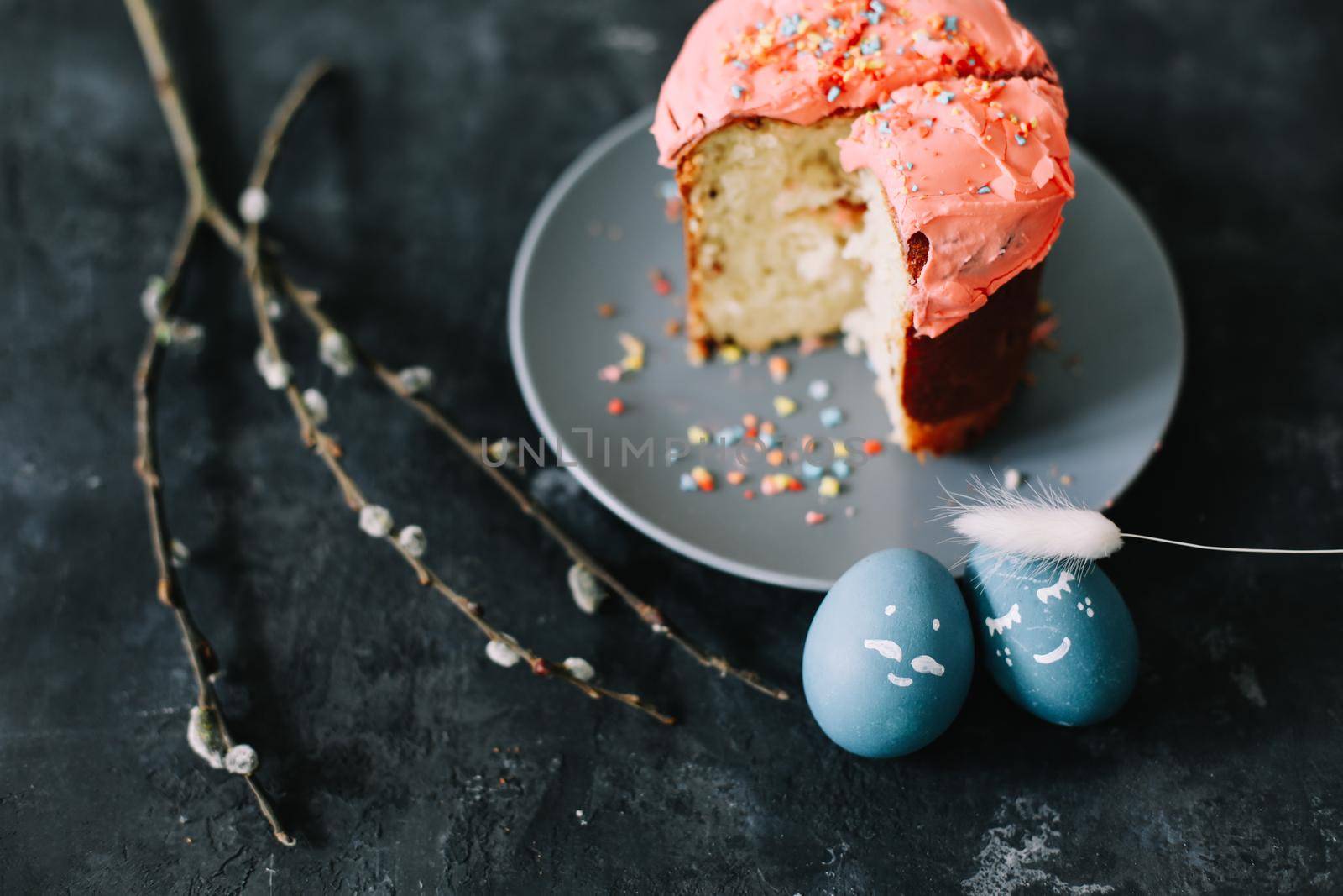 Easter cake, colorful eggs and willow branches. Happy Easter holiday concept. festive spring season.