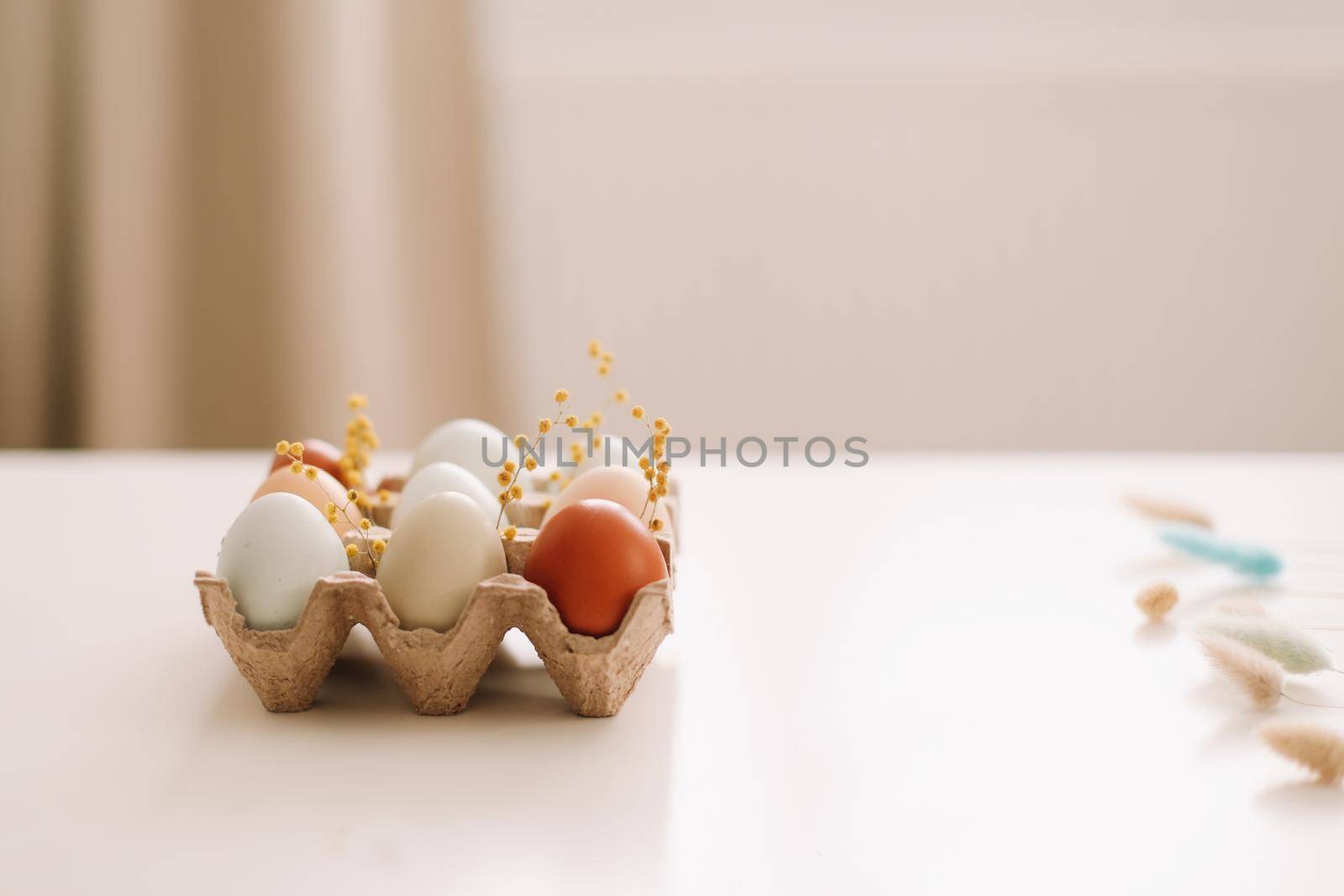 Chicken eggs of natural shades and colors on a white background. Healthy organic food, natural farmer's products concept. Happy Easter background. Selective focus. 