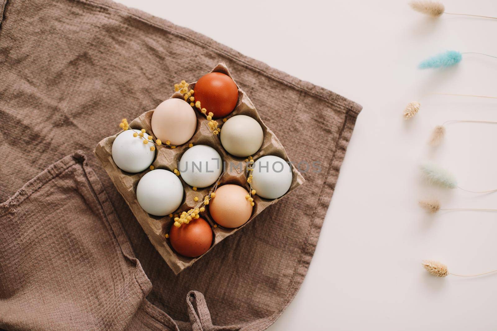 Chicken eggs of natural shades and colors on a white background. Healthy organic food, natural farmer's products concept. Happy Easter background. Selective focus. 