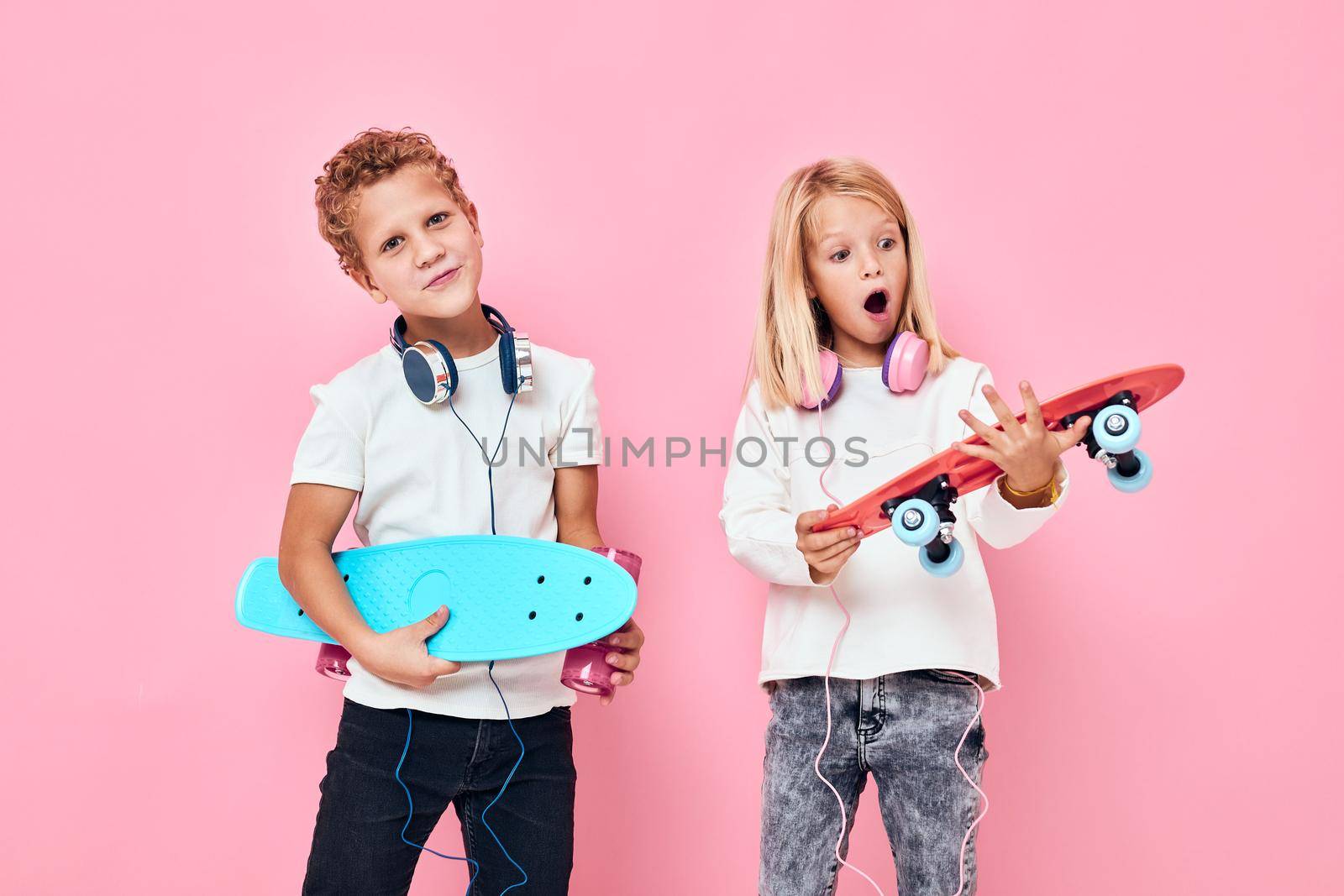 Active young people stand next to skateboards active lifestyle childhood. High quality photo