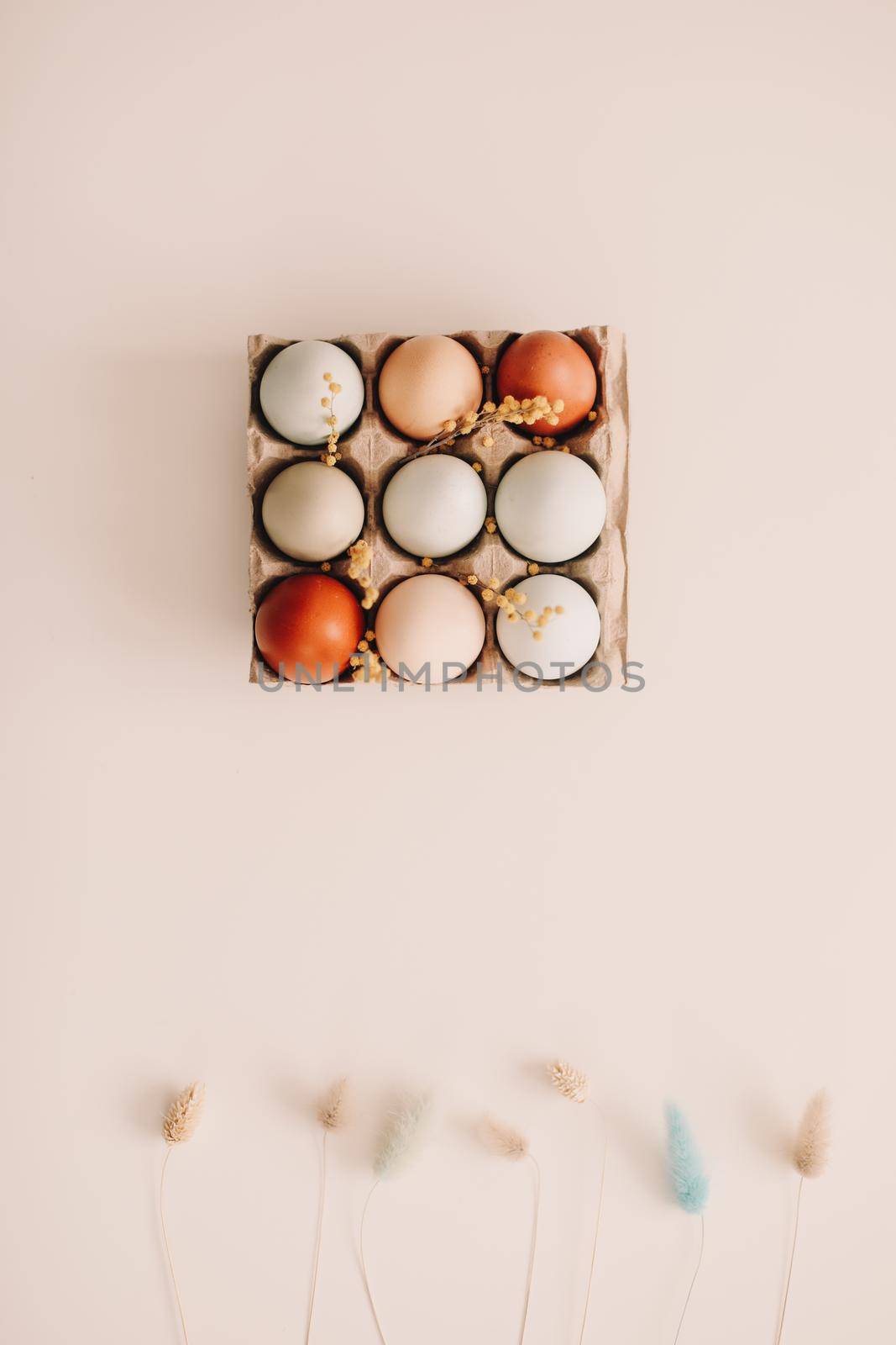 Chicken eggs of natural shades and colors on a white background. Healthy organic food, natural farmer's products concept. Happy Easter background. Selective focus. 