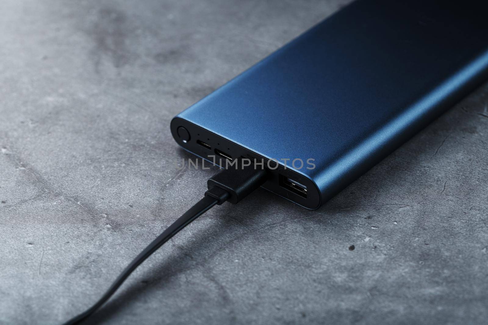 Battery Power supply for recharging gadgets and electronic devices on a dark background