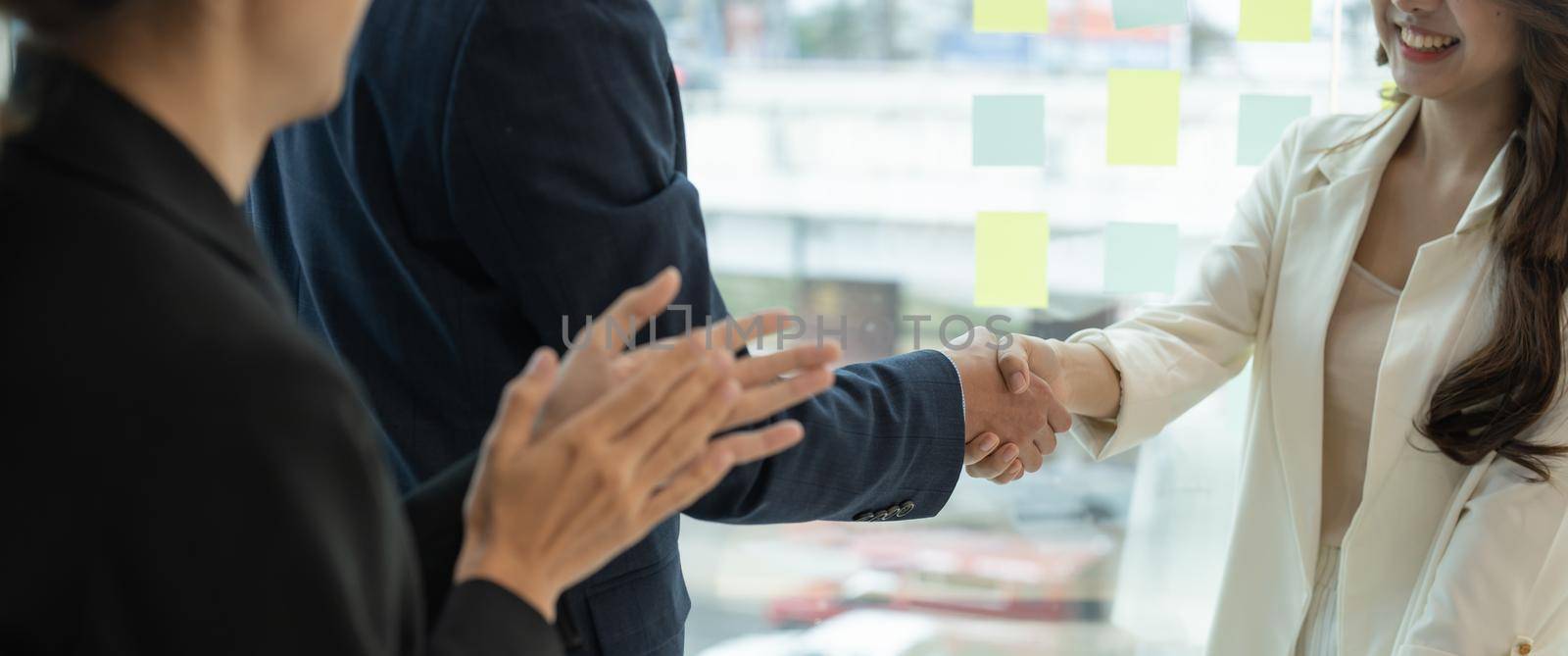 Business asian agreement and successful negotiation concept, businessman in suit shake hand with customer, client after formal communication and contract deal success by nateemee