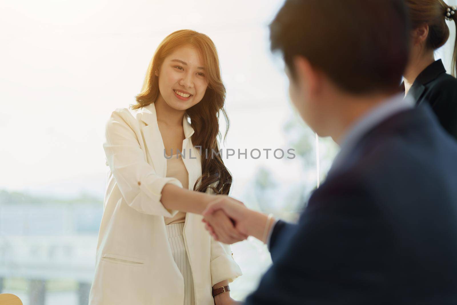 Partnership. asian business people shaking hand after business job interview in meeting room at office, congratulation, investor, success, interview, partnership, teamwork, financial, connection concept.